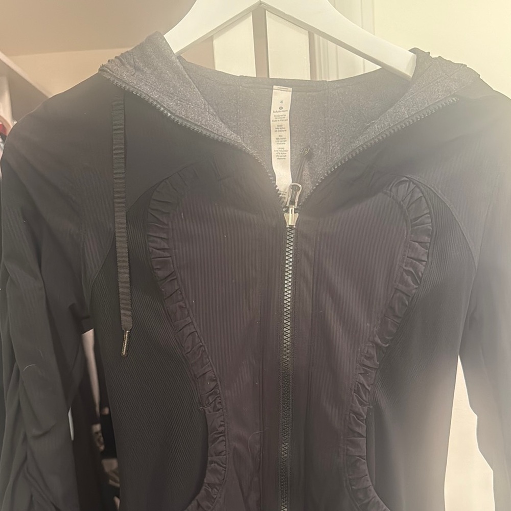 Lululemon size 4, hooded lightweight jacket. In perfect condition never worn.